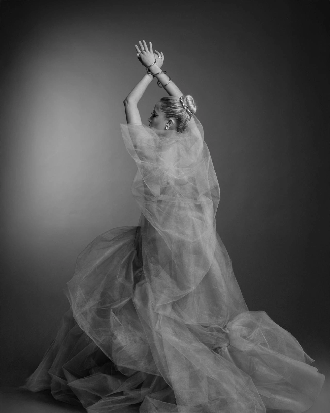 Black-and-white portrait of a woman in a dress